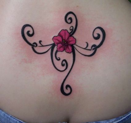 Small Flower Tats On Lower Back